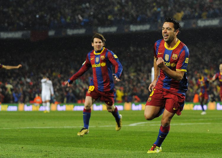 BARCELONA, SPAIN - NOVEMBER 29:  Xavi Hernandez of Barcelona celebrates after scoring the first goal during the La Liga match between Barcelona and Real Madrid at the Camp Nou Stadium on November 29, 2010 in Barcelona, Spain.  Barcelona won the match 5-0.  (Photo by David Ramos/Getty Images)